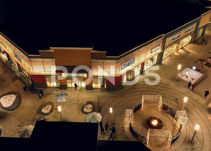 Tanger Outlet Mall Shoppers and consumers walk through outd... | Stock Video | Pond5 photo