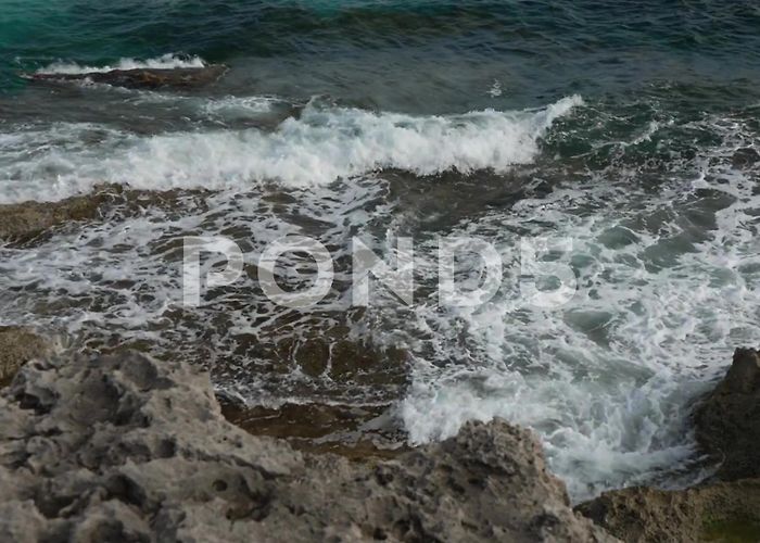 Illa de l'Aire Lighthouse Rocky coastline in Punta Prima and light... | Stock Video | Pond5 photo